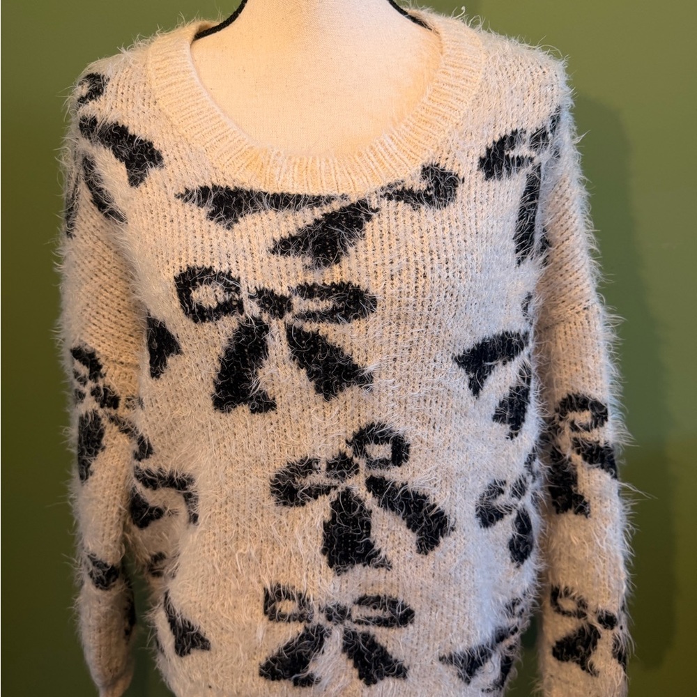 Elegant Black and Cream Bow Sweater